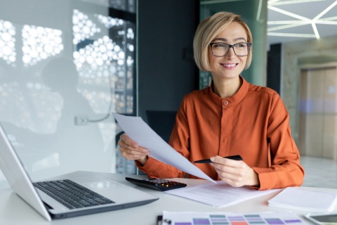 Accounts payable specialist working inside the office with documents