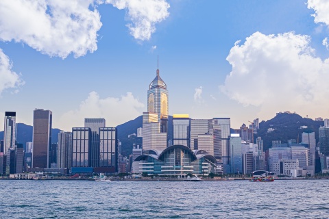 Victoria Harbor and Hong Kong Island skyline with clouds