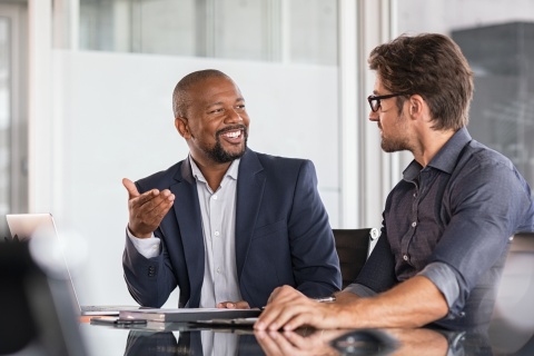 Global HR managers discussing remote team employee training programs
