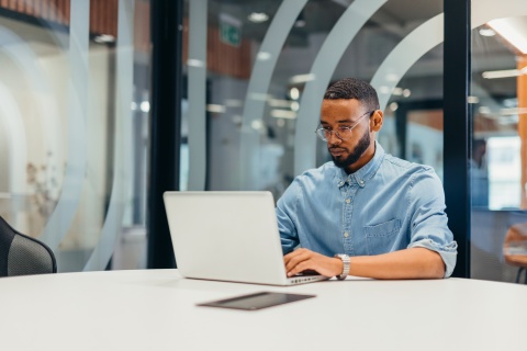 Businessman working on his laptop in an office