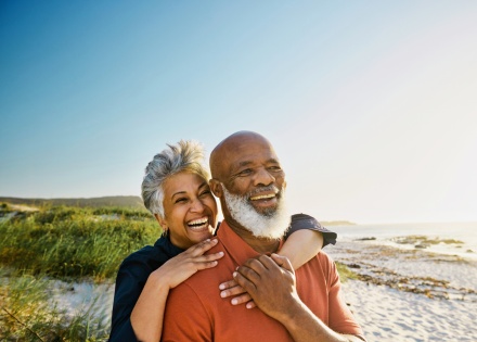 Couple smiling on a beach during the British Virgin Island’s public holidays