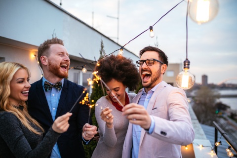 Friends celebrating a Danish public holiday with sparklers