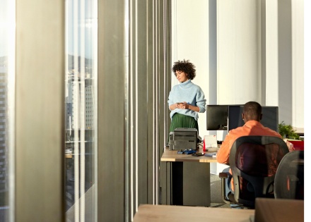 Two gen Z employees working from a co-work space