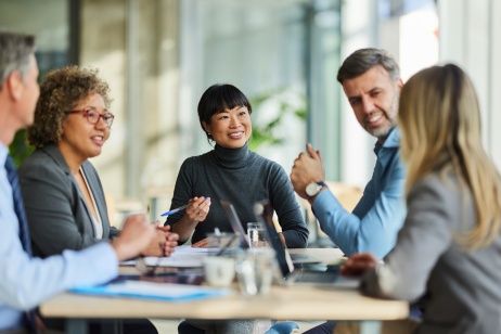 HR colleagues in a meeting discussing strategic global partnerships.