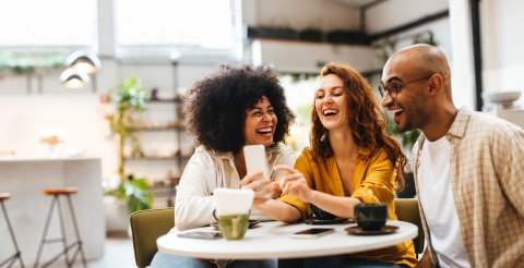 Friends laughing together during Togo’s public holidays