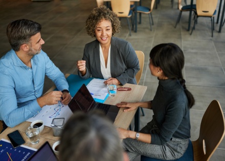 HR manager briefs team on getting work visas in Canada