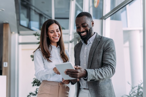 Two colleagues working together in a modern office