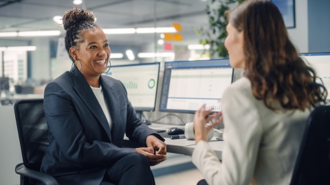 HR employees discussing how to switch payroll providers