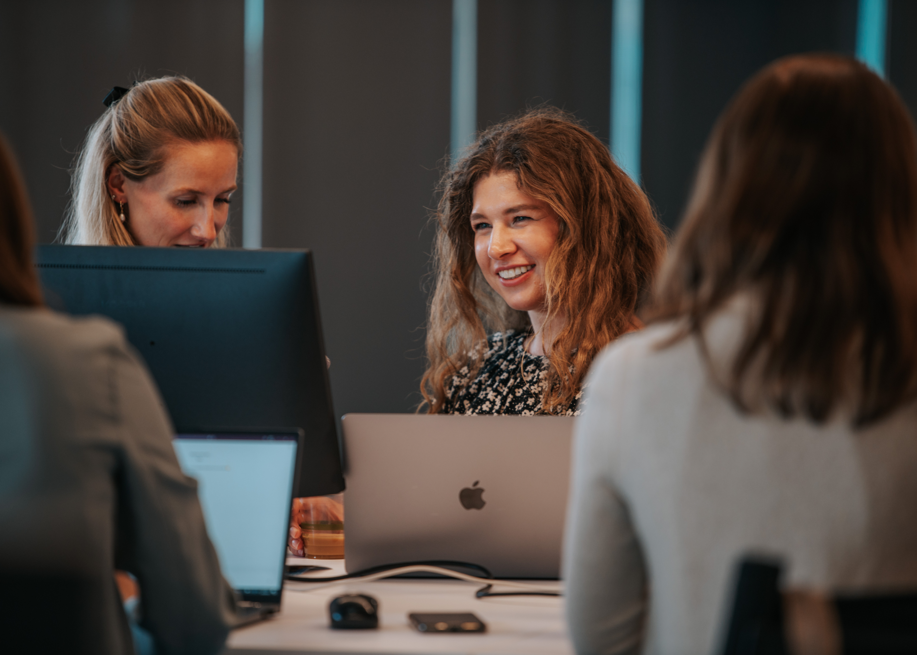 Pebl employees working side-by-side at the new headquarters in Denver, Colorado.